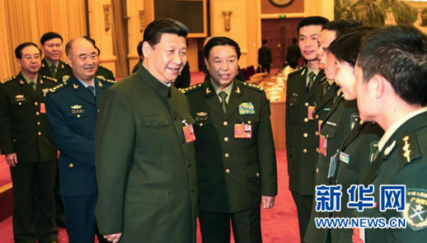2013年3月11日,习近平出席十二届全国人大一次会议解放军代表团全体会议并发表重要讲话。新华社记者 李刚摄